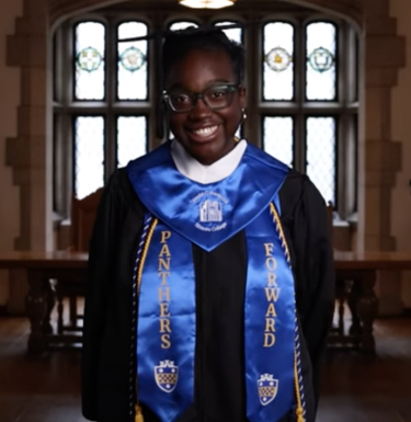 Mary Angbanzan wearing commencement regalia in the Cathedral of Learning's English Room.